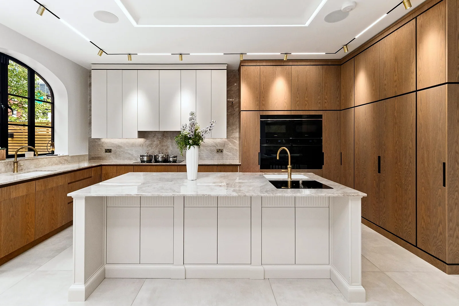 Kitchen island with walnut cabinetry, kitchen photography London